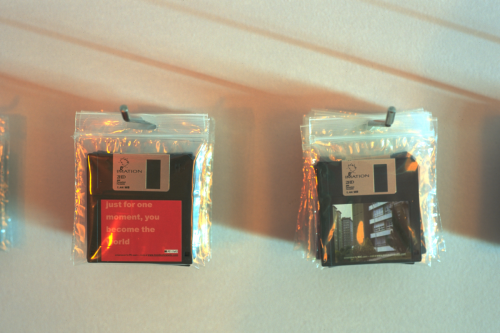 Floppy disks containing the screensavers hanging on the exhibition wall in Santiago de Compostela  (December 1, 2000 - January 14, 2001). Picture: Rony Vissers.